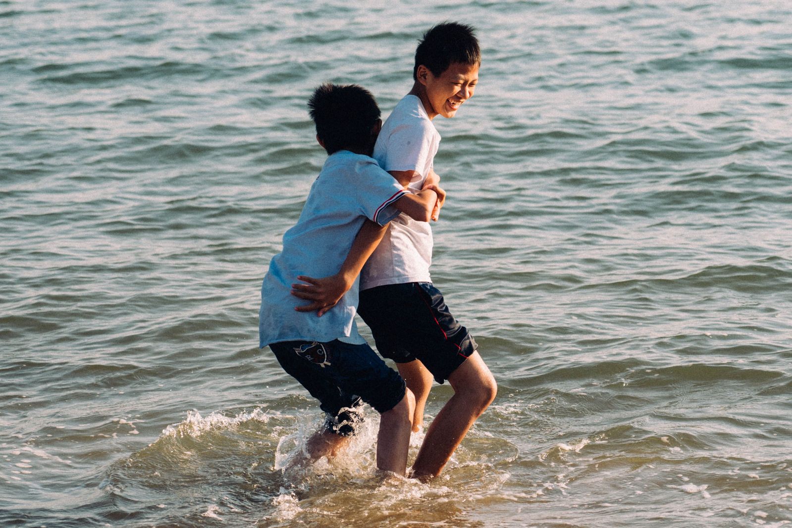 Kids playing in the waves